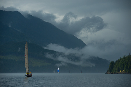 Sailboats navigate the islands between Johnstone Strait and the Strait of Georgia, British Columbia during the Van Isle 360 International Yacht Race, a 15-day sailing race around Vancouver Island, June 11, 2013.